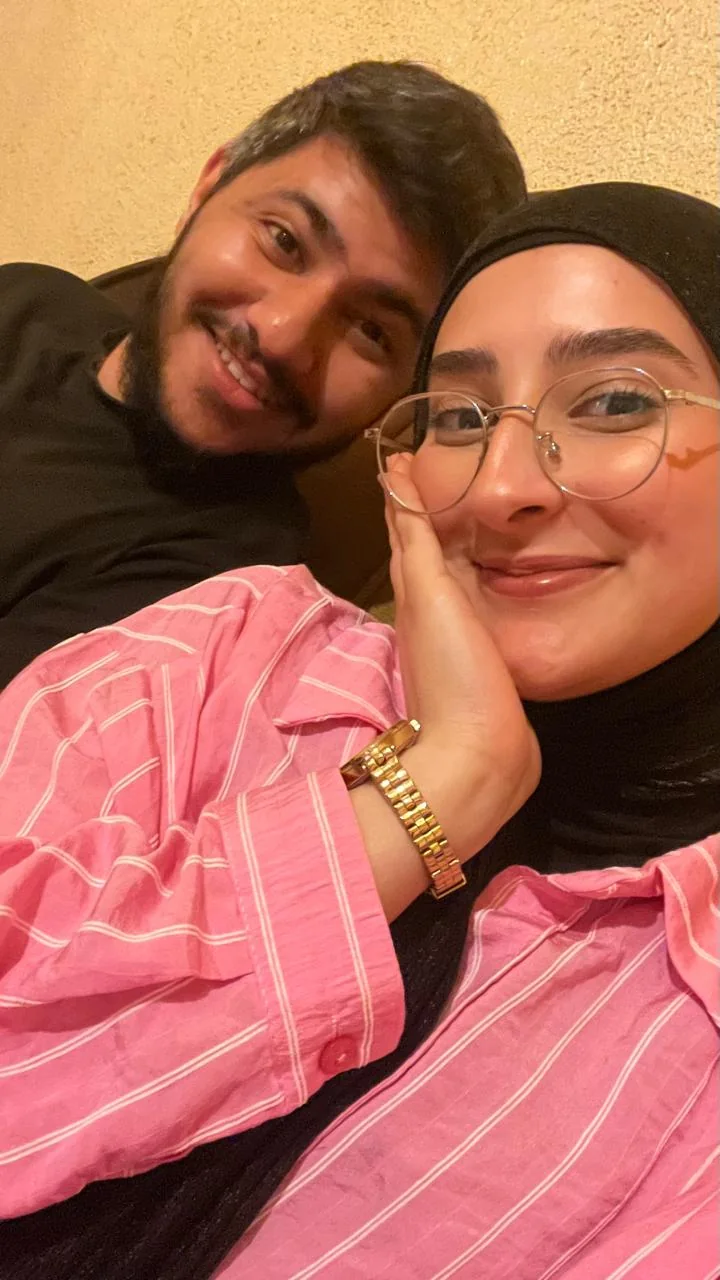A close selfie of the two of us; Fatima rests her cheek on her hand and smiles.